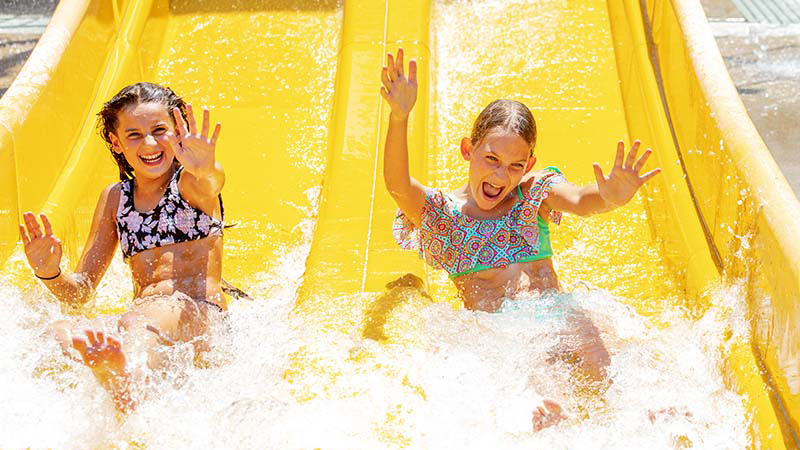 Sliding down slide at Buccaneer Cove